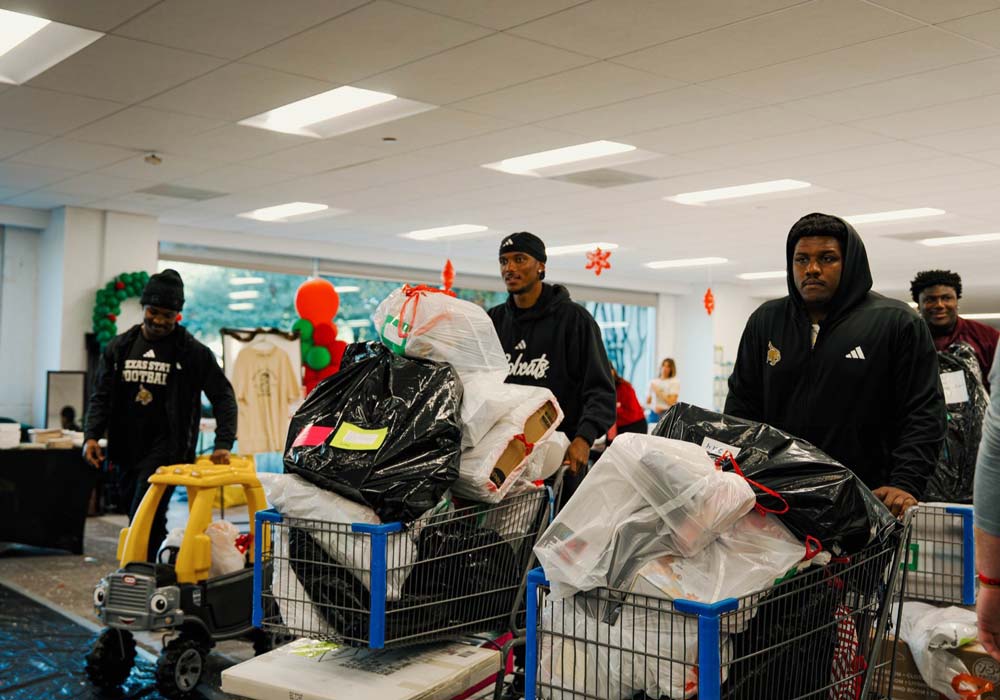 student athletes picking up trash